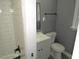 This bathroom features a sleek vanity, modern fixtures, and stylish white shower at 136 Dogwood Trl, Wendell, NC 27591