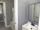 An organized bathroom with storage and a well-lit vanity area at 136 Dogwood Trl, Wendell, NC 27591