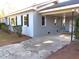 Charming exterior of home featuring a covered carport and lush landscaping at 136 Dogwood Trl, Wendell, NC 27591