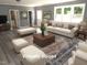 Comfortable living room with plush seating, a decorative rug, and plenty of natural light at 136 Dogwood Trl, Wendell, NC 27591