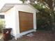 Detached garage or storage shed next to a trash can at 136 Dogwood Trl, Wendell, NC 27591