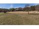 Stunning exterior view of a beautiful home surrounded by trees, showcasing the expansive front lawn at 1616 Bethlehem Rd, Knightdale, NC 27545