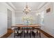 Traditional dining room with wainscoting, chandelier and table at 1881 Edith Dr, Raleigh, NC 27612