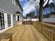 View of the new wooden back deck, perfect for outdoor gatherings and relaxation at 208 Lawrence Rd, Cary, NC 27511