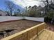 Spacious backyard with a freshly installed white privacy fence at 208 Lawrence Rd, Cary, NC 27511