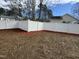 A fully fenced in backyard with a brand new, white fence for added privacy at 208 Lawrence Rd, Cary, NC 27511