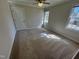 This bedroom has great natural light, with a ceiling fan for added comfort, and neutral walls at 208 Lawrence Rd, Cary, NC 27511