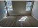 This bedroom offers lots of natural light from two windows, perfect for a cozy retreat at 208 Lawrence Rd, Cary, NC 27511
