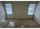 This bedroom offers lots of natural light from two windows, perfect for a cozy retreat at 208 Lawrence Rd, Cary, NC 27511