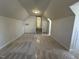 Spacious bonus room with high ceilings, carpet, and access to the attic at 208 Lawrence Rd, Cary, NC 27511