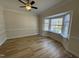 Bright dining room with a large bay window and crown molding at 208 Lawrence Rd, Cary, NC 27511