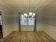 Bright dining room with hardwood floors, elegant wainscoting and plenty of natural light at 208 Lawrence Rd, Cary, NC 27511