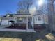 Exterior of home featuring a charming front porch with white railings and a well-manicured lawn at 208 Lawrence Rd, Cary, NC 27511