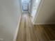 Hallway showing hardwood floors leading to laundry room at 208 Lawrence Rd, Cary, NC 27511