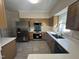 A beautifully kitchen featuring stainless steel appliances and ample cabinet space at 208 Lawrence Rd, Cary, NC 27511