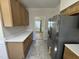 Modern kitchen featuring stainless steel appliances, quartz countertops and ample counter space at 208 Lawrence Rd, Cary, NC 27511
