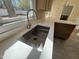 Close-up view of the kitchen sink with a modern faucet and quartz countertop at 208 Lawrence Rd, Cary, NC 27511