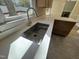 Close-up view of the kitchen sink with a modern faucet and quartz countertop at 208 Lawrence Rd, Cary, NC 27511