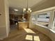 Open concept kitchen featuring an attached dining area with large windows for natural light at 208 Lawrence Rd, Cary, NC 27511