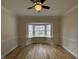 Cozy living room with a large bay window and wood floors at 208 Lawrence Rd, Cary, NC 27511