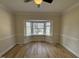Cozy living room with a large bay window and wood floors at 208 Lawrence Rd, Cary, NC 27511