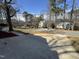 View of a quiet neighborhood street with well-kept homes and mature trees at 208 Lawrence Rd, Cary, NC 27511