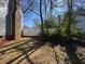 Side yard showing new white fence and mature landscaping at 208 Lawrence Rd, Cary, NC 27511