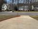 Residential street view of well-maintained homes with manicured front lawns and mature trees at 208 Lawrence Rd, Cary, NC 27511