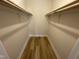 Empty walk-in closet with wooden floors and shelving, ready for personalization at 208 Lawrence Rd, Cary, NC 27511