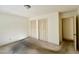A bright bedroom features a double closet with louvered doors and an en suite bathroom at 2118 N Woodland Rd, Henderson, NC 27536