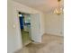 The dining room features a chandelier, carpet, and a view of the adjacent kitchen space at 2118 N Woodland Rd, Henderson, NC 27536