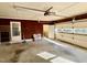 Spacious garage featuring an automatic door, side door, and plenty of space for storage and vehicles at 2118 N Woodland Rd, Henderson, NC 27536
