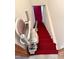 Carpeted stairs featuring stair-lift chair at 2118 N Woodland Rd, Henderson, NC 27536