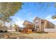 Exterior shot of a two-story home with a spacious backyard, deck, and partial fencing at 215 Oak Island Ct, Garner, NC 27529