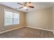 Standard bedroom featuring neutral carpet and a large window at 215 Oak Island Ct, Garner, NC 27529