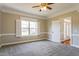 Bright bedroom with neutral paint, crown molding, carpeting, and a ceiling fan at 215 Oak Island Ct, Garner, NC 27529