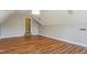 Spacious bonus room with hardwood style floors, bright lighting, and neutral walls at 215 Oak Island Ct, Garner, NC 27529