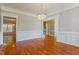 Open dining room with hardwood floors and a chandelier at 215 Oak Island Ct, Garner, NC 27529