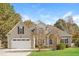 Charming single-Gathering home featuring a two-car garage and well-manicured lawn at 215 Oak Island Ct, Garner, NC 27529