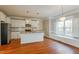 Stylish kitchen with stainless steel appliances, island, and hardwood floors at 215 Oak Island Ct, Garner, NC 27529