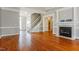 Bright and airy living room featuring a fireplace and hardwood floors at 215 Oak Island Ct, Garner, NC 27529