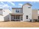 The backyard features a screened in patio and freshly cut grass at 2212 Jollay St, Durham, NC 27703