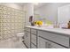 Bright bathroom with double vanity, modern fixtures, and a stylish patterned shower curtain at 2212 Jollay St, Durham, NC 27703