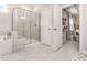 Bathroom featuring a glass-enclosed shower, soaking tub, and white tiled floors at 2212 Jollay St, Durham, NC 27703