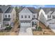 Charming two-story home with a stone facade, a two-car garage, and a welcoming front porch at 2212 Jollay St, Durham, NC 27703