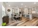 Open-concept kitchen and dining area featuring modern light gray cabinets and stainless steel appliances at 2212 Jollay St, Durham, NC 27703