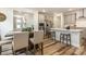 Bright eat-in kitchen features stainless appliances, light grey cabinetry, and dining area at 2212 Jollay St, Durham, NC 27703