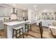 Modern kitchen with gray cabinets, stainless steel appliances, and a large island with seating at 2212 Jollay St, Durham, NC 27703
