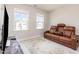 Comfortable media room featuring a plush leather recliner and a modern TV setup at 2212 Jollay St, Durham, NC 27703