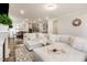 Open-concept living area with plush seating, fireplace, and views into the kitchen at 2212 Jollay St, Durham, NC 27703